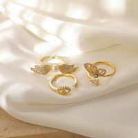 Copper 14K Gold Plated Elegant Lady Classic Style Inlay Devil's Eye Wings Butterfly Imitation Pearl Zircon Open Rings main image 1