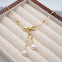 304 Stainless Steel Freshwater Pearl Gold Plated Casual Vintage Style Simple Style Infinity Bow Knot Pendant Necklace main image 6