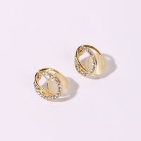 1 Pair Sweet Simple Style Shiny Oval Hollow Out Inlay Alloy Artificial Rhinestones Resin Gold Plated Ear Studs main image 4
