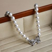 Großhandel Schmuck Elegant Glam Bogenknoten Künstliche Perle Kupfer Zirkon Inlay Halskette main image 1
