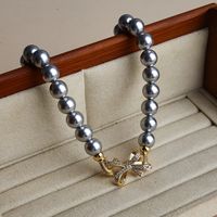 Großhandel Schmuck Elegant Glam Bogenknoten Künstliche Perle Kupfer Zirkon Inlay Halskette main image 3