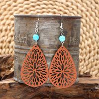 1 Pair Vintage Style Ethnic Style Simple Style Water Droplets Beaded Hollow Out Wood Drop Earrings main image 1
