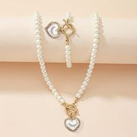 Alliage Élégant Dame Bohémien Incruster Forme De Cœur Perles Artificielles Zircon Bracelets Collier main image 1
