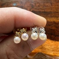 1 Pair Simple Style Bow Knot Inlay Sterling Silver Pearl Zircon Ear Studs main image 1