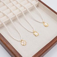 Vintage Style Simple Style Flower Imitation Pearl Copper Inlay Shell Zircon Gold Plated Women's Pendant Necklace main image 1