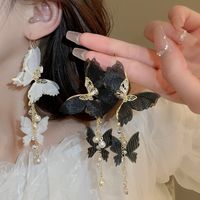 1 Pair Elegant Vintage Style Butterfly Chain Inlay Copper Pearl Zircon Drop Earrings main image 1