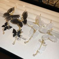 1 Pair Elegant Vintage Style Butterfly Chain Inlay Copper Pearl Zircon Drop Earrings main image 3