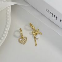 1 Pair Sweet Simple Style Heart Shape Bow Knot Asymmetrical Hollow Out Inlay Sterling Silver Shell Zircon Drop Earrings main image 1