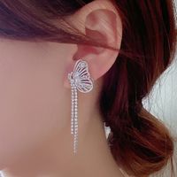 1 Pair IG Style Exaggerated Simple Style Butterfly Hollow Out Inlay Artificial Pearl Copper Zircon Drop Earrings main image 10