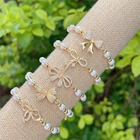 Wholesale Jewelry Sweet Simple Style Classic Style Bow Knot Artificial Pearl Copper Artificial Pearls Copper Zircon 18K Gold Plated Plating Inlay Bracelets main image 1