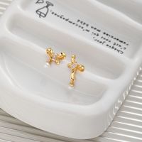 1 Pair Sweet Simple Style Bow Knot Hollow Out Inlay Sterling Silver Pearl Zircon Ear Studs main image 3