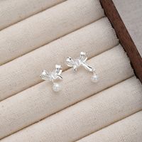 1 Pair Sweet Simple Style Bow Knot Hollow Out Inlay Sterling Silver Pearl Zircon Ear Studs main image 4