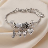 Großhandel Schmuck Süss Einfacher Stil Rose Schmetterling Hoher Absatz Aryl Legierung Kupfer Strasssteine Emaille Inlay Carving Armbänder main image 4