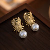 1 Pair Elegant Modern Style Classic Style Round Plating Inlay Copper Gem Rhinestones Pearl Gold Plated Ear Studs main image 3