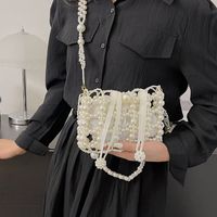 Women's Small Pearl Solid Color Elegant Classic Style Beading Hollow String Crossbody Bag main image 1