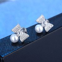 1 Pair Elegant Modern Style Commute Bow Knot Inlay Copper Artificial Pearls Zircon Drop Earrings main image 1