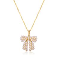 Kupfer Lässig Elegant Einfacher Stil Inlay Bogenknoten Künstliche Perlen Zirkon Halskette Mit Anhänger sku image 9