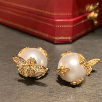 1 Pair Simple Style Shiny Bee Hollow Out Inlay Sequin Brass Artificial Pearls Zircon Gold Plated Ear Studs main image 4