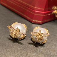 1 Pair Simple Style Shiny Bee Hollow Out Inlay Sequin Brass Artificial Pearls Zircon Gold Plated Ear Studs main image 5