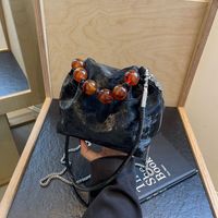 Women's Medium Pu Leather Solid Color Elegant Classic Style Beading Bucket String Crossbody Bag main image 8