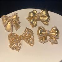 Sweet Simple Style Bow Knot Metal Hollow Out Inlay Pearl Women's Brooches main image 5