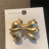 Sweet Simple Style Bow Knot Metal Hollow Out Inlay Pearl Women's Brooches sku image 2