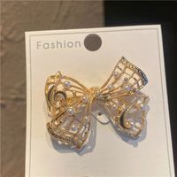 Sweet Simple Style Bow Knot Metal Hollow Out Inlay Pearl Women's Brooches sku image 1