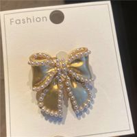 Sweet Simple Style Bow Knot Metal Hollow Out Inlay Pearl Women's Brooches sku image 3