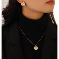 Brass Retro Simple Style Inlay Round Moon Shell Zircon Earrings Necklace main image 2