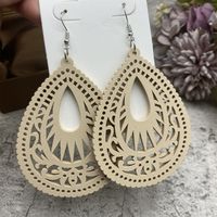 1 Pair Casual Ethnic Style Water Droplets Stoving Varnish Hollow Out Wood Drop Earrings sku image 1
