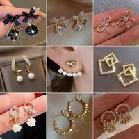 Elegant Geometric Bow Knot Imitation Pearl Alloy Inlay Rhinestones Women's Earrings 1 Pair main image 1