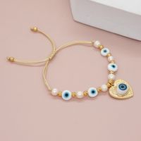 Simple Style Classic Style Devil's Eye Freshwater Pearl Glass Soft Clay Beaded Braid Drawstring Bracelets main image 1
