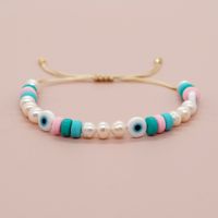 Simple Style Classic Style Devil's Eye Freshwater Pearl Glass Soft Clay Beaded Braid Drawstring Bracelets main image 5