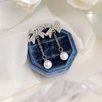 1 Pair Elegant Romantic Bow Knot Plating Inlay Alloy Artificial Rhinestones Artificial Pearls White Gold Plated Drop Earrings main image 6