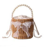 Women's Small Rattan Solid Color Vacation Beach Pearls Weave Bowknot Cylindrical String Straw Bag main image 5
