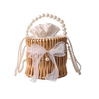 Women's Small Rattan Solid Color Vacation Beach Pearls Weave Bowknot Cylindrical String Straw Bag sku image 1