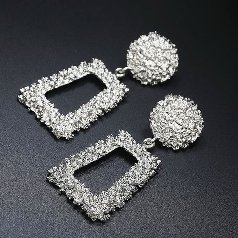 Exaggerated   Simple Geometric Embossed Flower Earrings