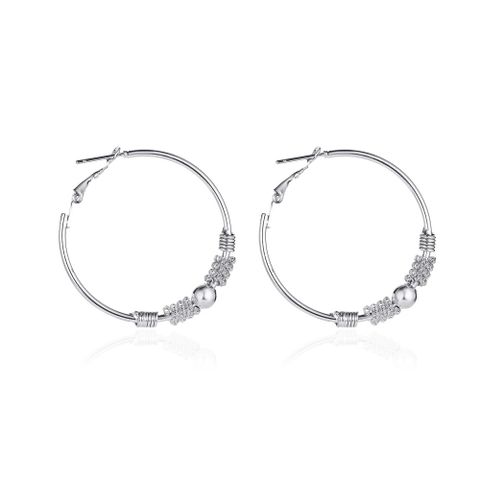 New Earrings Temperament Simple Geometric Hollow Circle Earrings Ear Buckle Winding Beaded Earrings Wholesale Nihaojewelry