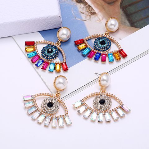 Exaggerated Devil's Eye Pearl Alloy Inlaid Colored Diamonds Earrings Wholesale