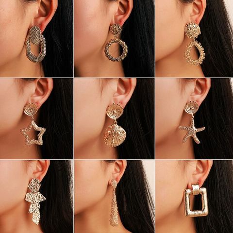 Mode Kreative Geometrische Metall Sternschale Unregelmäßige Ohrringe Großhandel