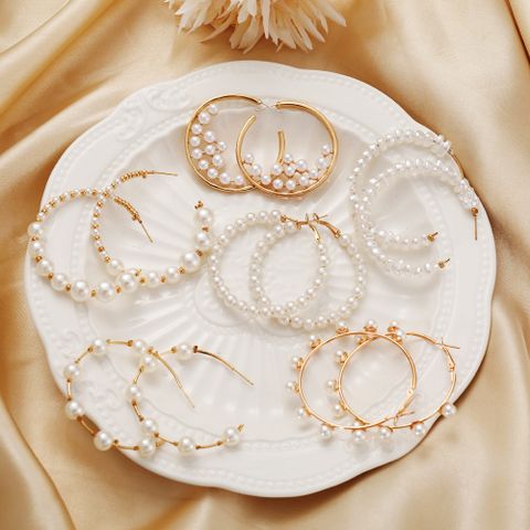 Wholesale Jewelry Retro Pearl C-shaped Earrings Nihaojewelry