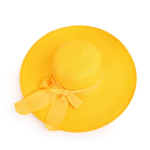 Nihaojewelry Moda Color Sólido Aleros Grandes Sunshadebowknot Sombrero De Paja Al Por Mayor