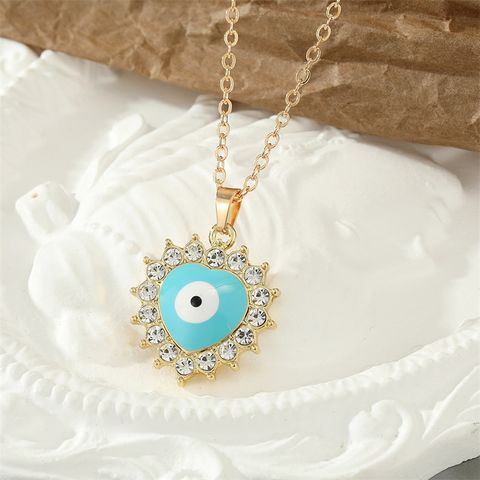 Retro Rhinestone Drip Oil Round Heart-shaped Eye Necklace Wholesale