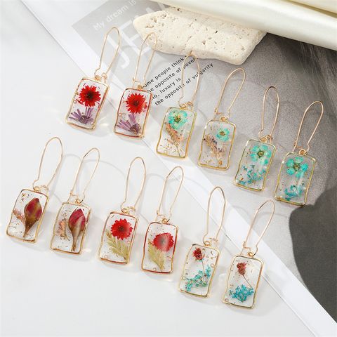 Simple Style Flower Synthetic Resin Alloy Epoxy Transparent Women's Dangling Earrings 1 Pair