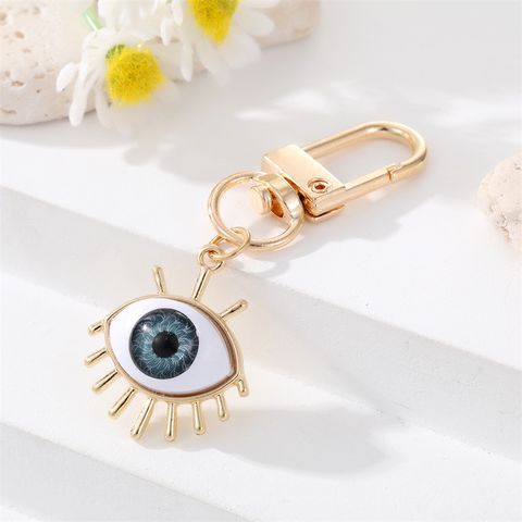 Alloy Base Support Diamond-embedded Colorful Devil's Eye Keychain Gold Electroplated Resin Patch Handbag Pendant