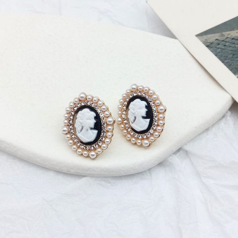 Luxurious Portrait Alloy Inlay Artificial Pearls Ear Studs