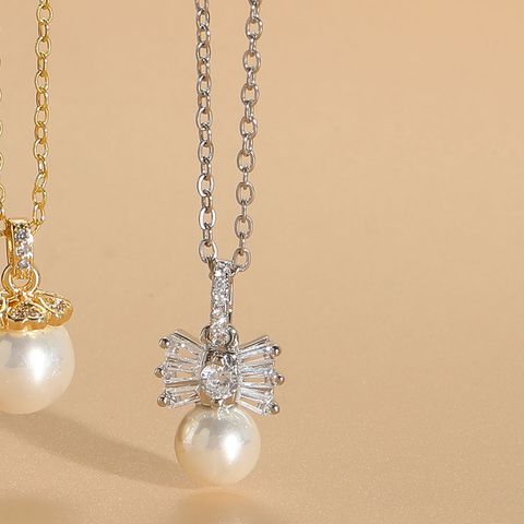 Elegant Vacation Simple Style Star Crown Bow Knot Copper 14k Gold Plated White Gold Plated Artificial Pearls Zircon Pendant Necklace In Bulk