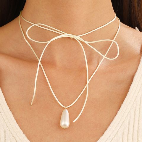 Simple Style Bow Knot Pu Leather Imitation Pearl Patchwork Women's Pendant Necklace