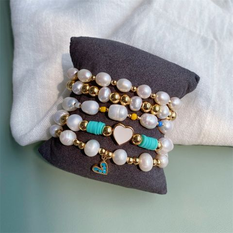 Einfacher Stil Herzform Gemischte Materialien Perlen Frau Armbänder