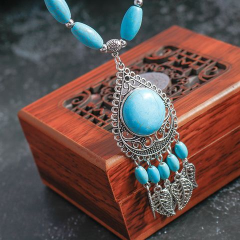 Wholesale Jewelry Retro Exaggerated Leaves Elephant Alloy Plastic Iron Turquoise Plating Hollow Out Inlay Pendant Necklace